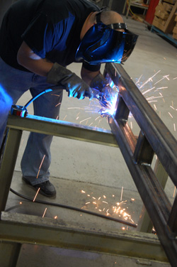 Image of welder working on metal fabrication