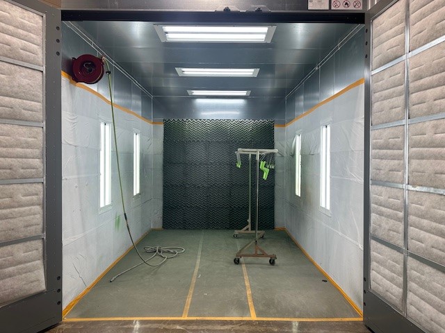 industrial metal finishing equipment in falk precision machine shop side view