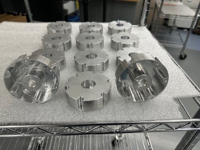 metal fabrication components on table