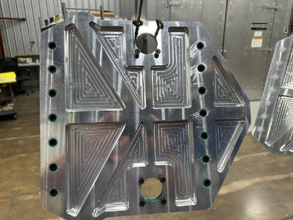 metal fabrication large silver component at machine shop